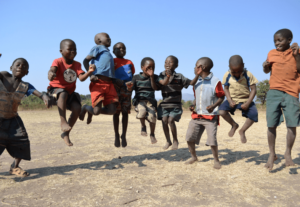 Group of African children jumping in the air