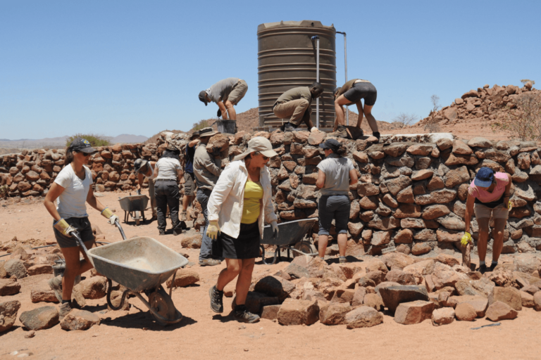 Image of volunteers helping build elephant-proof structures