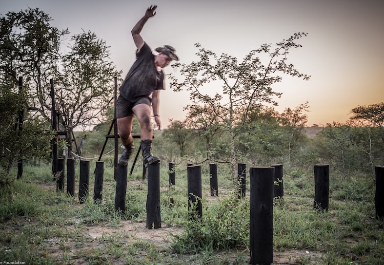 anti-poaching ranger doing obstacle course