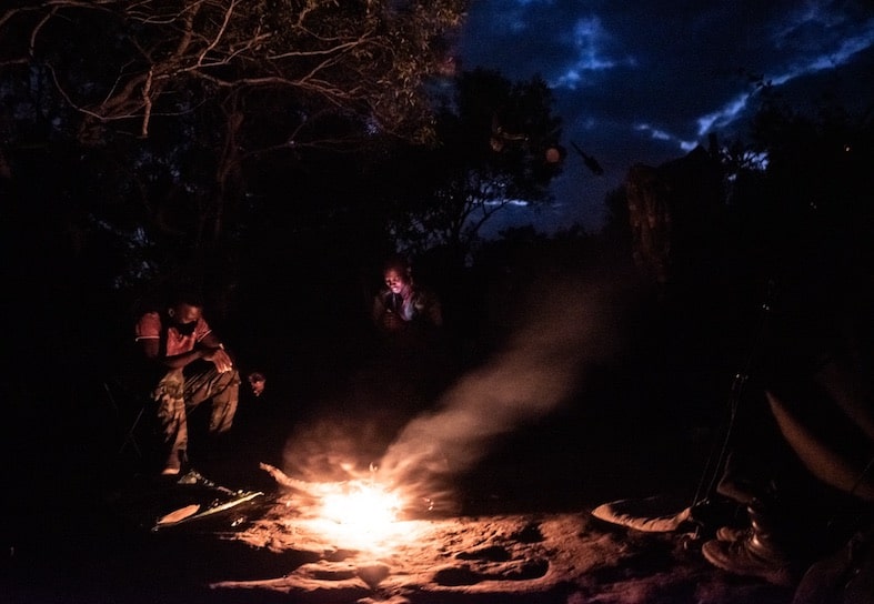 rangers around the fire at night