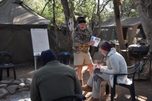 Volunteers in bushcamp learning about anti-poaching