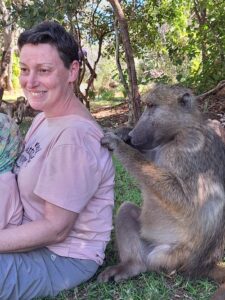 Andrea being groomed by baboon