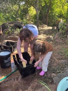 Two family volunteers cleaning