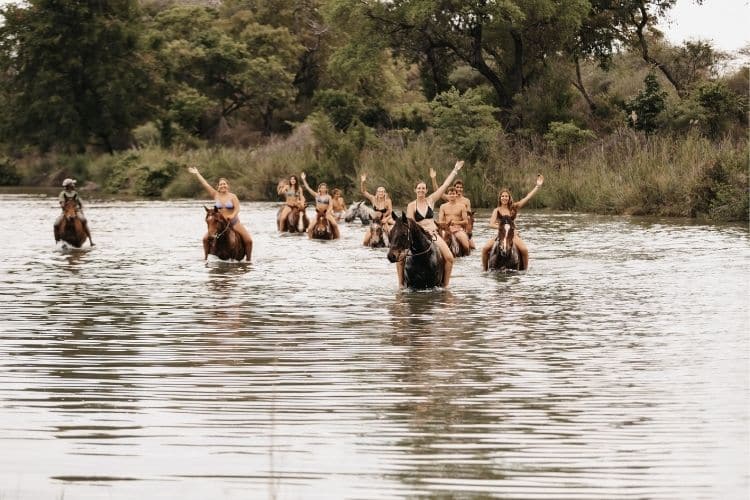 Working holiday horse riders swimming