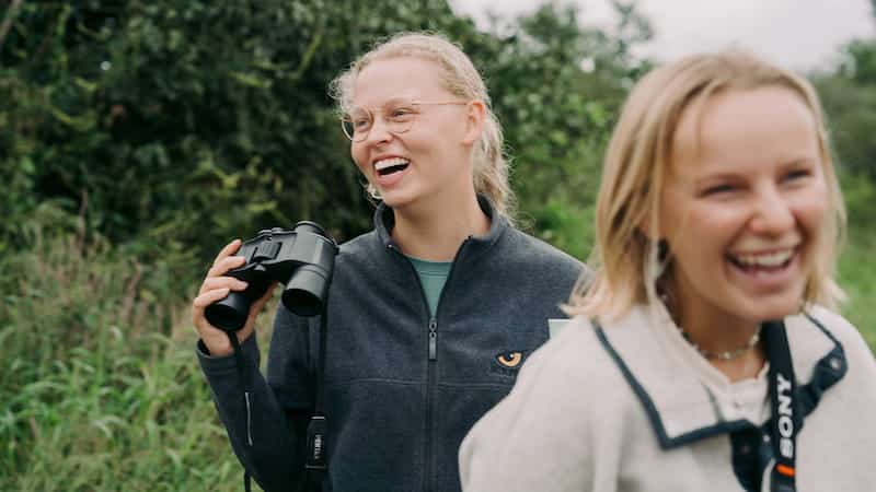 Two volunteers laughing